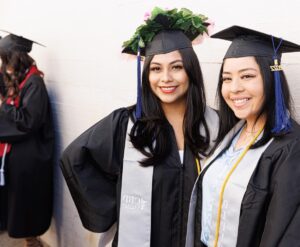 Female graduates from CBD College celebrating their achievements at a graduation ceremony.