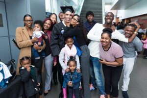 CBD College 2016 Winter Graduation: Student celebrating with family.