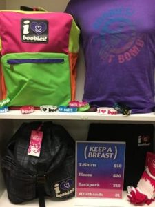 Image showcasing Keep A Breast merchandise available for sale by CBD College's Student Affairs team, including t-shirts, backpacks, wristbands, and pullover fleece, with proceeds benefiting the Keep A Breast Foundation.
