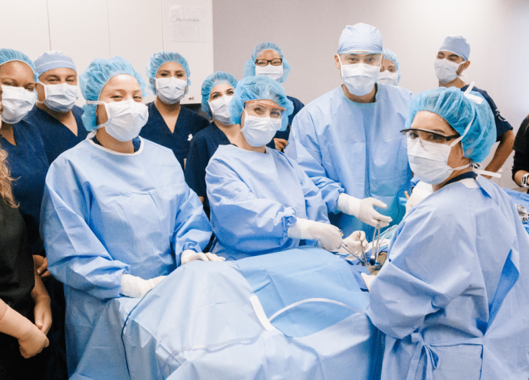CBD College surgical team and students in operating room.