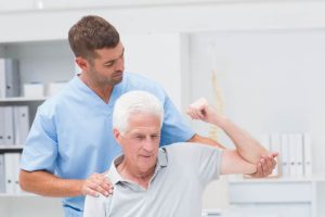 Image representing physical therapy, showing a therapist guiding a patient through exercises or rehabilitation activities to promote healing and recovery.