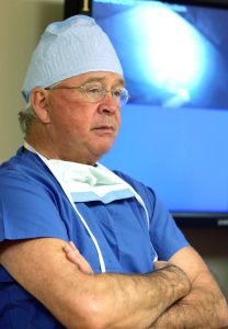 Portrait of Dr. James Andrews, orthopedic surgeon, practicing at the Andrews Sports Medicine & Orthopaedic Center in Birmingham, Alabama, and the Andrews Institute for Orthopaedics & Sports Medicine in Gulf Breeze, Florida. He is renowned for his expertise in knee, elbow, and shoulder injuries.